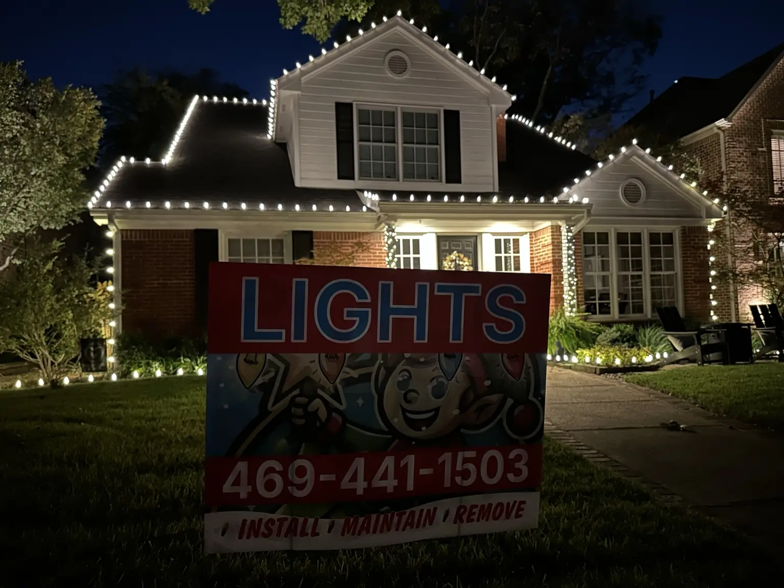 Lovers Lane Roofline Installation | Elf's Christmas Lights Lovers Lane home with warm-white roofline lights and an Elf's Christmas Lights yard sign
