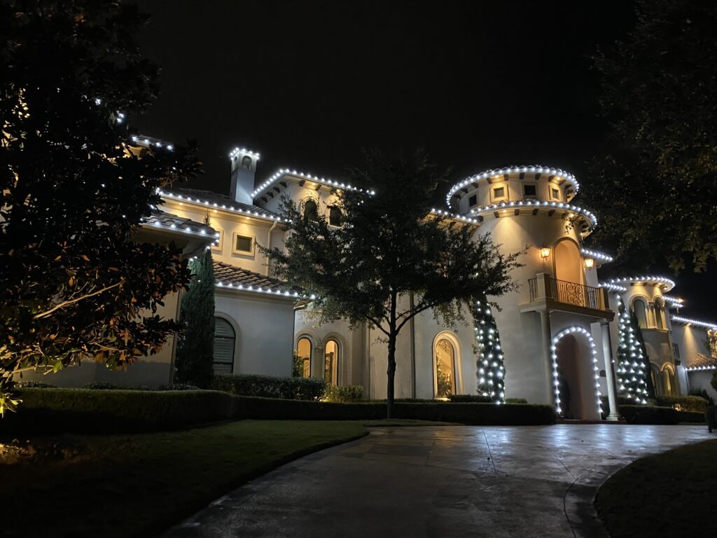 Festive home decorated with holiday lights in Whiffletree & Deerfield Plano