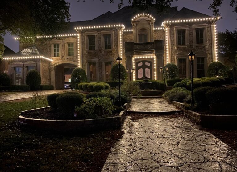 Big house in Highland Park wrapped in festive holiday lights.