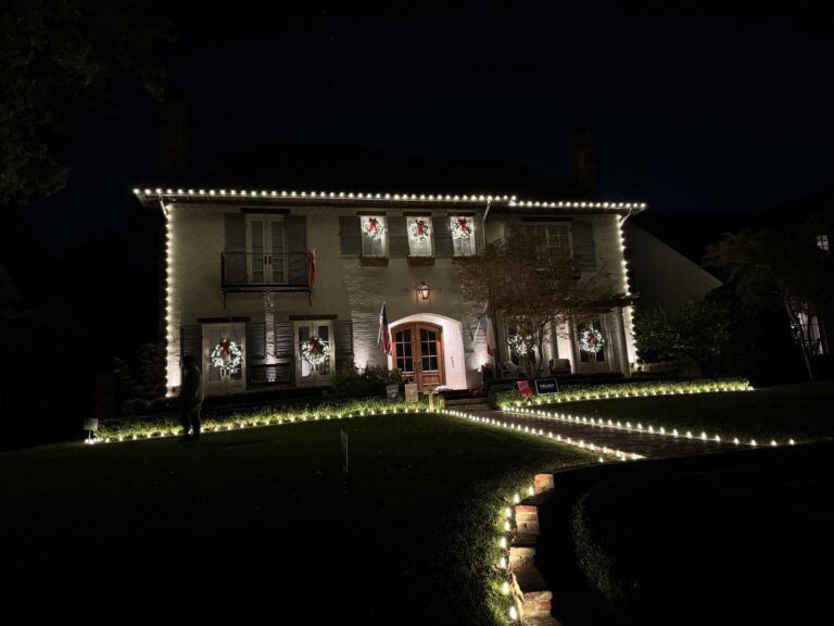 Holiday home in Brockdale Estates Lucas, Texas decorated with glowing Christmas lights.